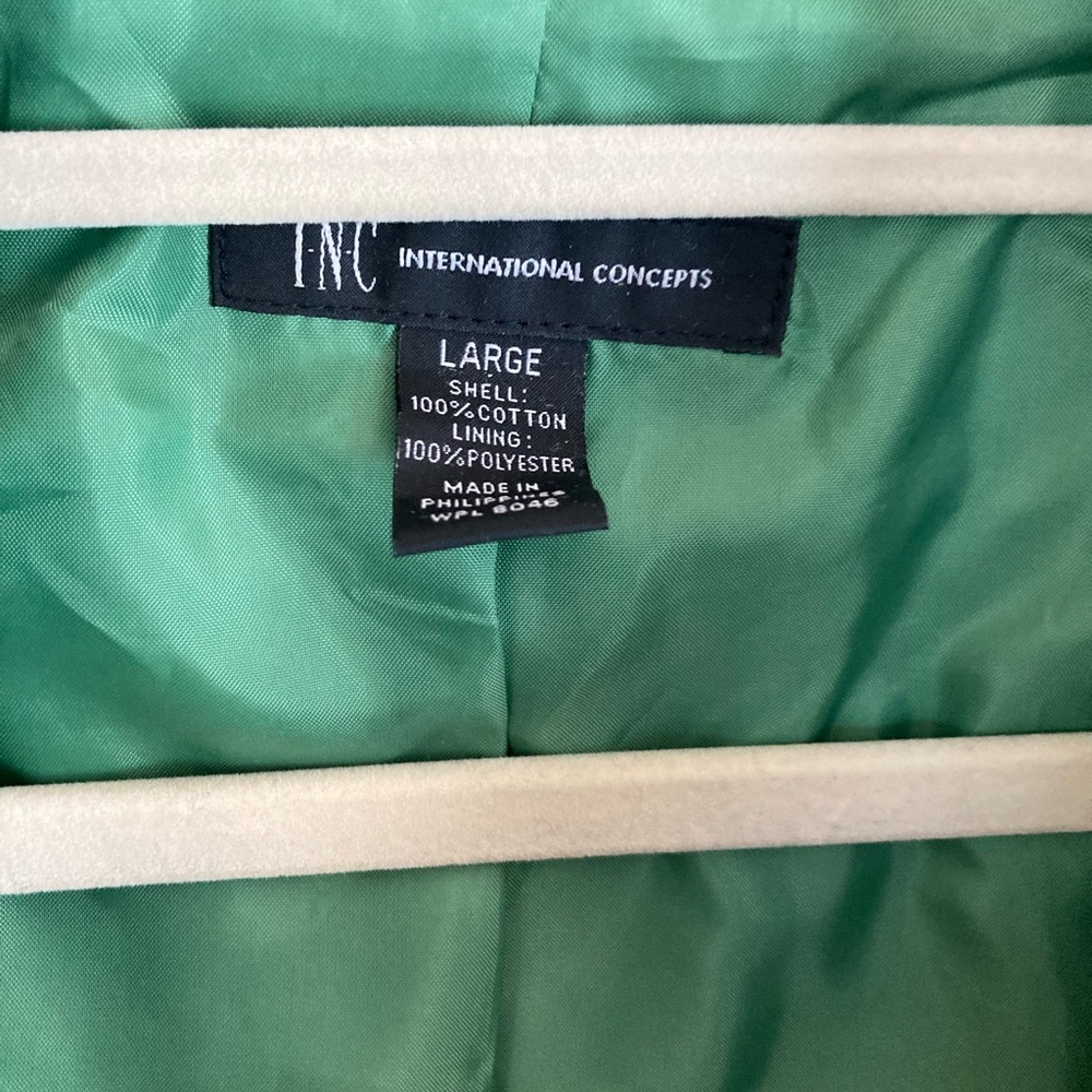 Green ladies coat with black trim , INC